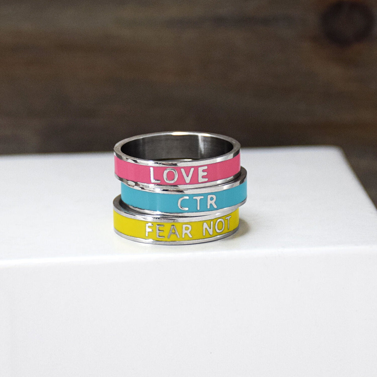 Enamel CTR Stainless Steel Ring 3 Pack in pink, yellow, and teal